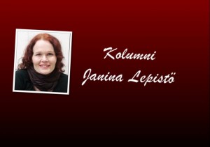 Janina Lepistö hymyilee, taustalla Vaasan kaupungin logo