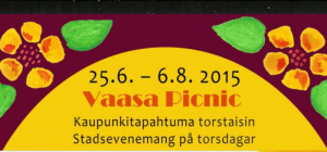 Iloinen piknik-tapahtuma Vaasassa, ihmisiä ja ruokaa nurmikolla