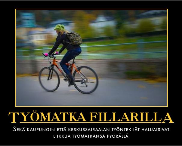 Pyöräilijä matkalla töihin aurinkoisena aamuna