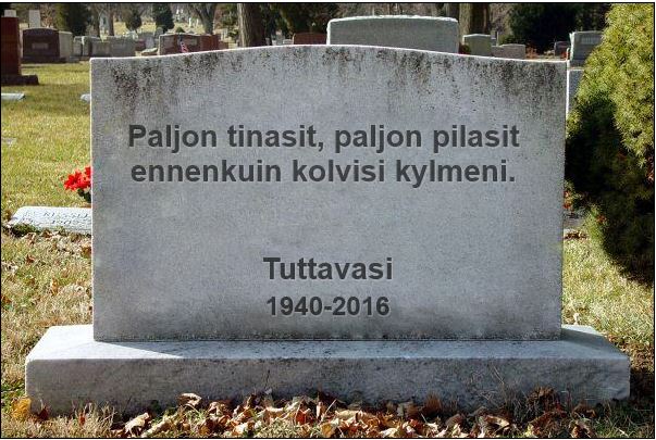 Hautakivi, jossa on kaiverruksia ja kukkia