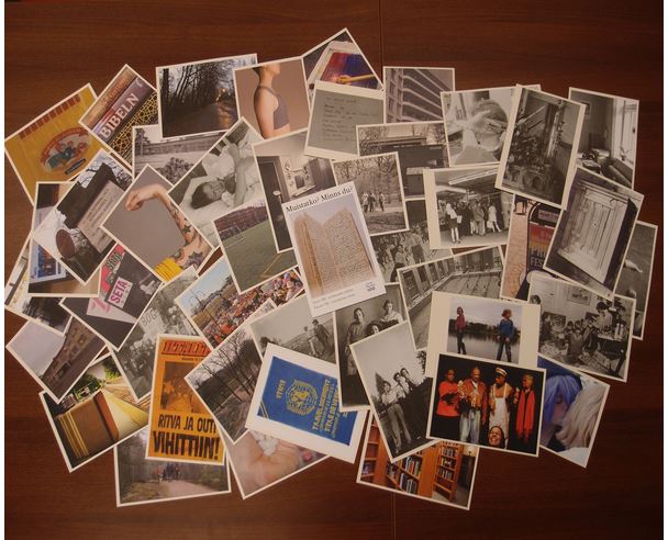 Sateenkaaren väreissä koristeltu kahvipöytä, jossa on leivonnaisia